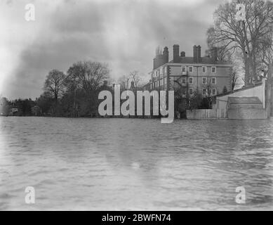 The Thames floods . Eton College recreation ground and one of the playing fields under deep water . One of the college buildings is seen in the picture . 6 January 1926 Stock Photo