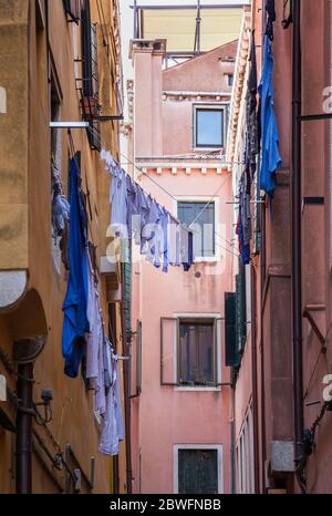 Washing hanging out to dry high up in a Venice backstreet Stock Photo