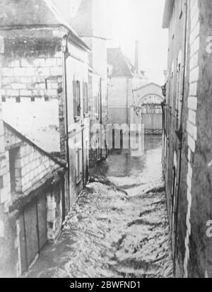 Serious Paris floods . The flooding of Paris has begun . The Seine has passed the danger mark and invaded streets , houses , and shops by the riverside . A flood scene in one of the streets at Angers . 3 January 1923 Stock Photo