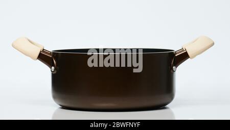 Clean brown metal pot side view isolated on white background Stock Photo