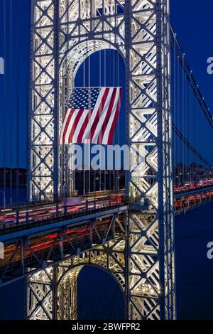 George Washington Bridge GWB with the worlds largest free flying American flag Stock Photo