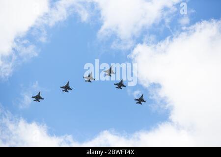 A view of United States Air Force F-16 fighter planes in the sky as they fly over hospitals and Covid-19 test sites in Slovenia. Six United States Air Force Lockheed Martin F-16 fighter planes from the 31st USAF Fighter Wing stationed in Aviano, Italy, and three Slovenian Air Force PC-9 of the 15th regiment of Slovenian Airforce jointly flew over hospitals and Covid-19 test sites in Slovenia to honour the first official day of the end of the epidemic in Slovenia, and thank all medical and other personnel for their efforts during the Covid-19 epidemic. Stock Photo