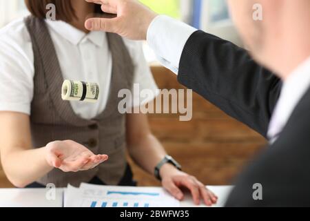 Focused photo on man that throwing bundle of money Stock Photo