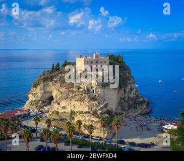 Tropea, Italy - September 10, 2019: Panorama of Tropea beach with view on the Sanctuary of Santa Maria dell'Isola church on rock in blue sea. Stock Photo