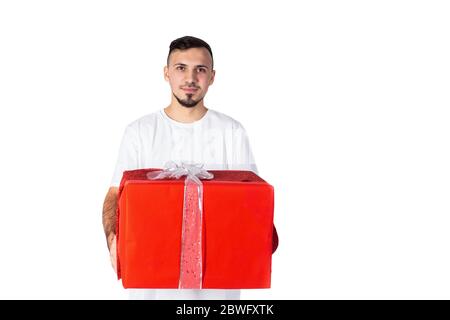 unshaven man with present box. Happy birthday. Man share present. Romantic greeting. Boxing day. Love date. Valentines day gift. Male fashion. Stock Photo
