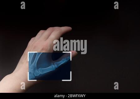 partial x-ray of hand on brown background, scanning hand, futuristic technology with biometric. Cyber security network Stock Photo