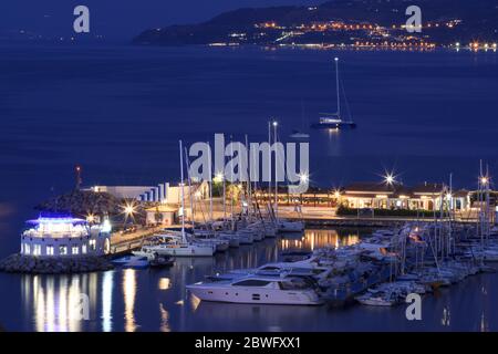 Tropea, Italy - September 6, 2019: Night illumination of Tropea town of South Italy. View at yacht port of Tropea with night lights and sea Stock Photo