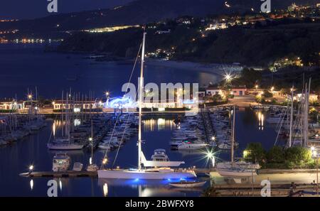 Tropea, Italy - September 6, 2019: Panorama of Tropea yacht sea port with beautiful night colorful lights. Night illumination of Tropea city, Calabria Stock Photo