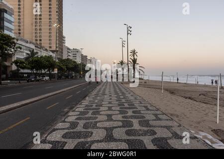 Beautiful sunset view to the pattern on the sidewalk in Ipanema Beach, Rio de Janeiro, Brazil Stock Photo