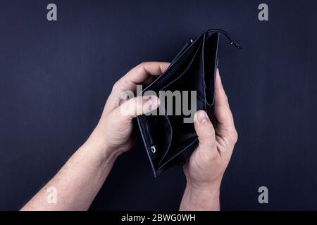 empty wallet and frustrated man - a Royalty Free Stock Photo from Photocase