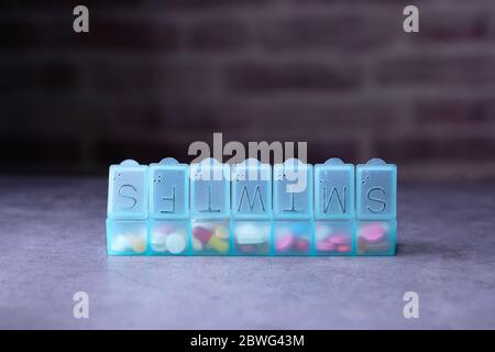 Close up of green color pill box on table  Stock Photo