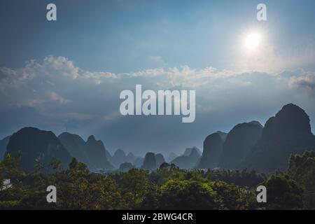 Beautiful impressive karst mountain landscape in Yangshuo on a sunny hot overcast summer day, Guangxi Province, China Stock Photo