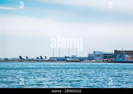 TORONTO, ONTARIO - APRIL 18, 2020: A planes are staying at Billy Bishop Toronto City Airport on April 18, 2020 in Toronto, Canada during Coronavirus p Stock Photo