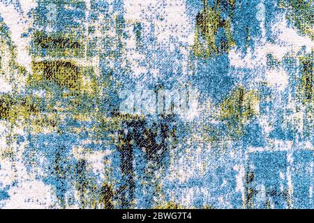 Texture of the carpet with a blue-yellow abstract pattern. Stock Photo