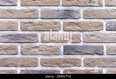 Brick wall of beige bricks. Background and texture of brickwork. Stock Photo