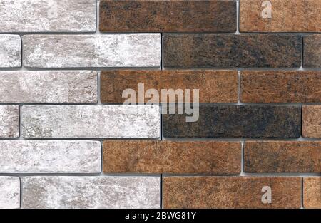 Brick wall of white and brown bricks. Background and texture of brickwork. Stock Photo