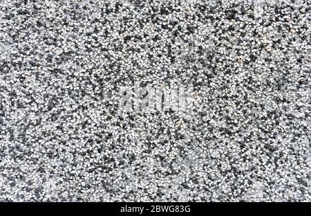 Texture of fine light gray gravel or sea pebbles. Stock Photo