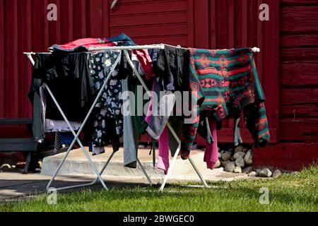 Freshly washed laundry is drying outdoors in springlike weather Stock Photo