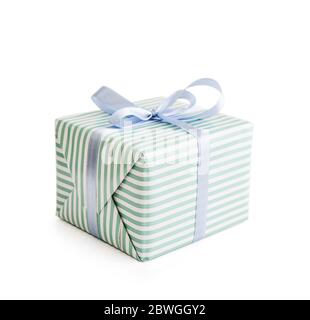 Striped gift box with blue ribbon isolated on white background with clipping path Stock Photo