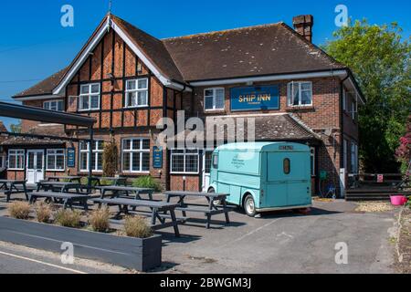 The Ship Inn with a vintage Citroen H Van in the foreground in Itchenor West Sussex, a popular village for boating and sailing. Stock Photo