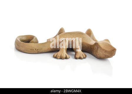 Traditional balinese wooden souvenir in shape of gecko isolated on white background Stock Photo