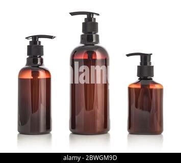 Plastic brown bottles with dispenser pumps isolated on white background. Stock Photo