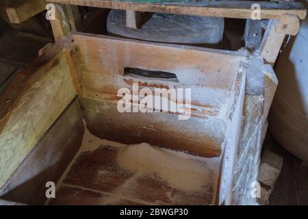 Traditional millstone for grinding grains at rustic mill . Stock Photo