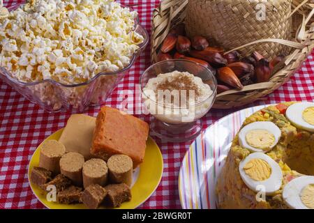 Table with typical food of the Brazilian June party. Stock Photo