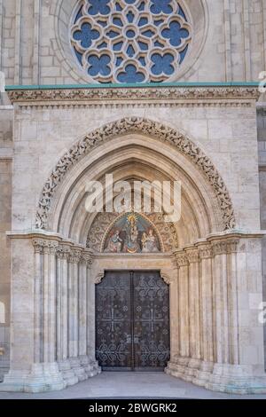 West side entrance of Matthias church with Mary the Lady of the Hungarians in Budapest Stock Photo
