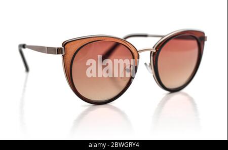 Women's sunglasses with brown lenses isolated on white background, clipping path included Stock Photo