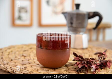 Design ceramic coffee cup with coffee in cozy room Stock Photo