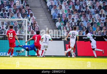 Borussia Park Moenchengladbach Germany 31.5.2020, Football: Bundesliga Season 2019/20 matchday 29, Borussia Moenchengladbach (BMG, white) vs FC Union Berlin (FCU, red) — Marcus Thuram (Borussia Moenchengladbach), right goal for 2:0 The stands have been filled with photographic portraits of  supporters at their usual stand or seat. Due to the Corona virus pandemic all german league matches are played in empty stadiums without spectators.   Foto: MORITZ MUELLER/POOL/via kolvenbach  DFL regulations prohibit any use of photographs as image sequences and/or quasi-video.   Editorial use only! Stock Photo