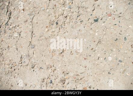 Cracked concrete top view texture background. Damaged gray concrete footpath Stock Photo