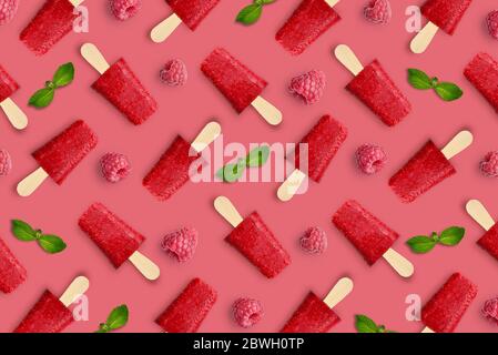 Pattern from raspberry popsicle on pink background Stock Photo