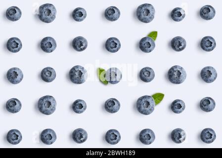 Blueberries on blue background,  top view, flat lay pattern. Stock Photo