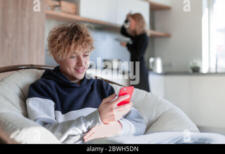 Happy man using phonet in the kitchen Stock Photo