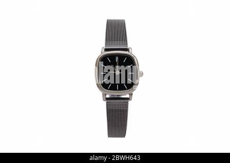 Classic square dress wristwatch with black matte metal mesh strap and black dial face, isolated on white background. Stock Photo