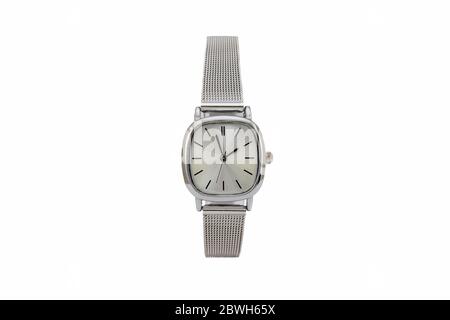Classic square dress wristwatch with matte metal mesh strap and gray dial face, isolated on white background. Stock Photo