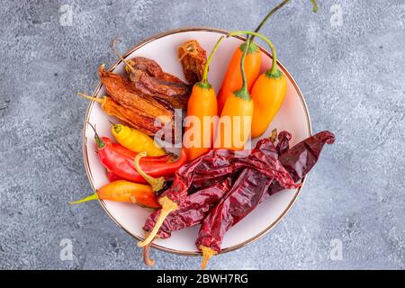 View of several Peruvian peppers, such as yellow chili, limo chili and paprika Stock Photo