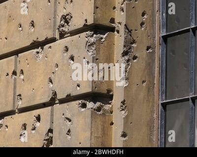 Bullet holes from World War 2 are still visible on the Storehouse of the Academy of Fine Arts in Vienna, Austria. The damage occurred in April 1945. Stock Photo