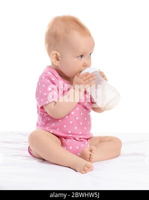 Cute little baby with bottle of milk on white background Stock Photo