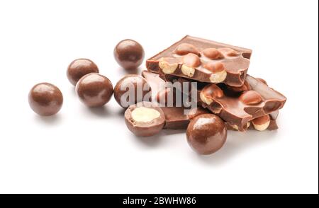 Tasty chocolate candies with nuts on white background Stock Photo