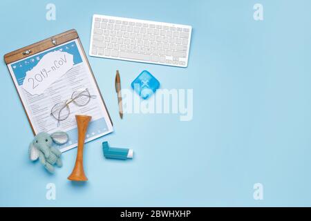 Laboratory test form, computer keyboard and toy on color background. Concept of coronavirus epidemic Stock Photo