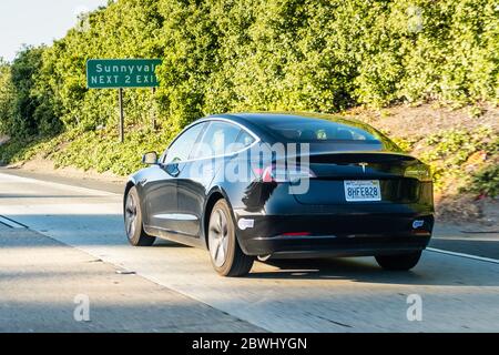 May 22, 2020 Sunnyvale / CA / USA - Tesla Model 3 driving on the freeway in Silicon Valley Stock Photo