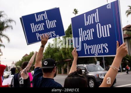 A Black Lives Matter Inland Empire demonstration in the city of Riverside, California, USA in protest of the death of George Floyd a 46 year old Black man, who was killed by Minneapolis police police on May 25th while being arrested. He died after a police officer applied his knee to Mr. Lloyds neck for more than nine minutes, while the suspect was on the ground and handcuffed. Mr. Floyds death has triggered massive protests all across the United States, including here in Riverside. Stock Photo