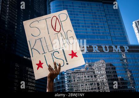 Beijing, USA. 30th May, 2020. A demonstrator holds a placard during a protest over the death of George Floyd in front of Trump Tower in Chicago, the United States, May 30, 2020. Credit: Christopher Dilts/Xinhua/Alamy Live News Stock Photo