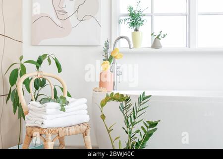 Interior of bathroom with floral decor Stock Photo