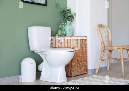 Interior of modern bathroom with floral decor Stock Photo