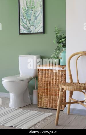 Interior of modern bathroom with floral decor Stock Photo