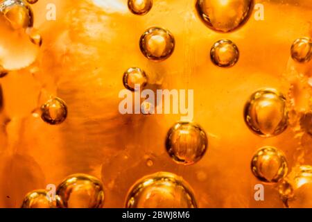 abstract water with  bubbles soars over a golden background Stock Photo